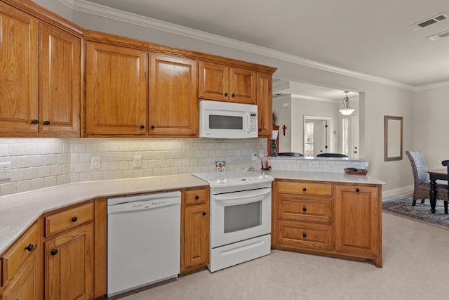 kitchen with crown molding, white appliances, backsplash, a peninsula, and brown cabinets