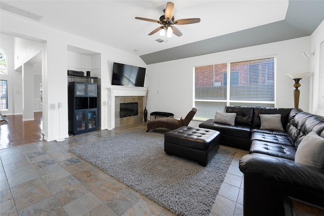 1808 Paddington Ct, Arlington, TX 76017 - living room featuring ceiling fan, a tile fireplace, lofted ceiling, baseboards, and built in features