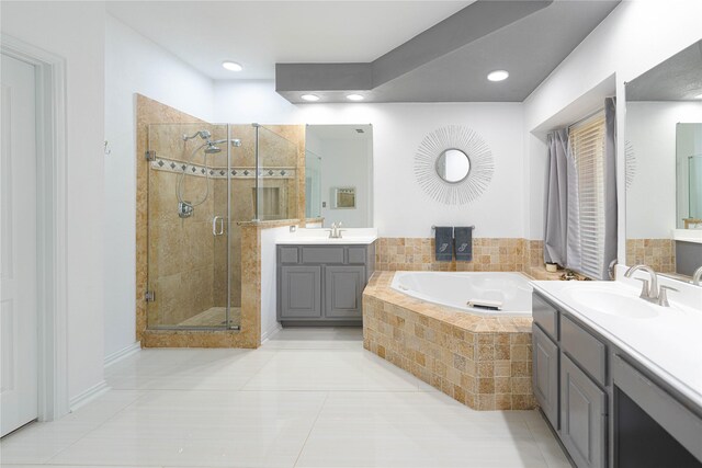 1808 Paddington Ct, Arlington, TX 76017 - bathroom featuring a bath, a stall shower, tile patterned floors, two vanities, and recessed lighting