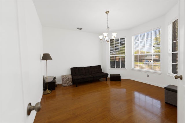 1808 Paddington Ct, Arlington, TX 76017 - sitting room with a chandelier, wood finished floors, and baseboards