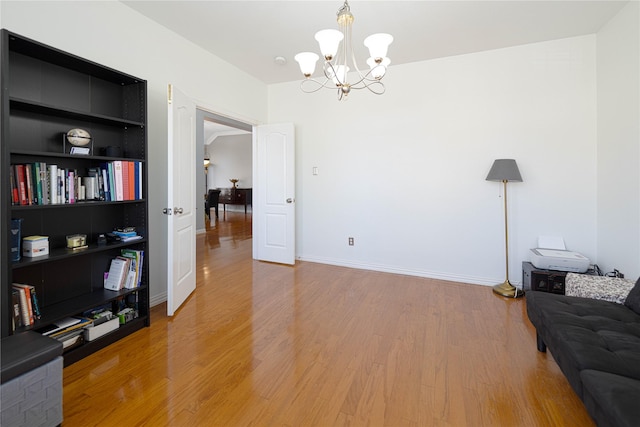 1808 Paddington Ct, Arlington, TX 76017 - living area featuring a chandelier, light wood-style floors, built in features, and baseboards
