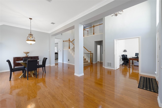 1808 Paddington Ct, Arlington, TX 76017 - dining area featuring stairway, light wood-type flooring, ornamental molding, a desk, and baseboards