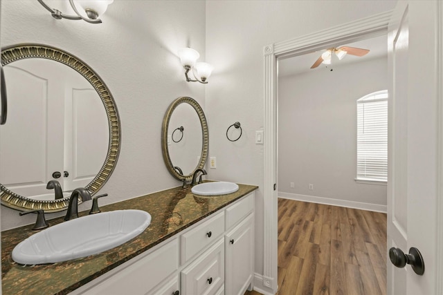 153 Whispering Winds Dr, Gunter, TX 75058 - full bath featuring ceiling fan, wood finished floors, double vanity, and baseboards