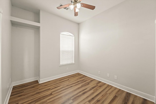 153 Whispering Winds Dr, Gunter, TX 75058 - unfurnished bedroom featuring baseboards, wood finished floors, and a ceiling fan