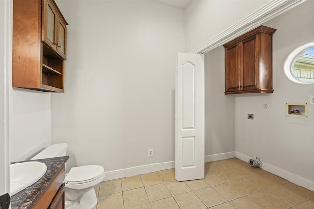 153 Whispering Winds Dr, Gunter, TX 75058 - laundry area with electric dryer hookup, light tile patterned flooring, baseboards, and hookup for a washing machine