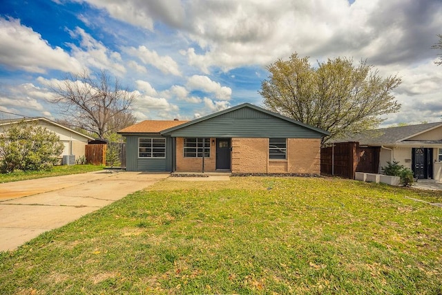 2112 Pontiac Dr, Carrollton, TX 75006 - ranch-style house with brick siding, fence, and a front lawn