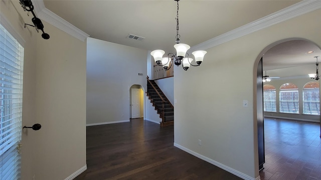 corridor with baseboards, visible vents, arched walkways, dark wood-type flooring, and an inviting chandelier