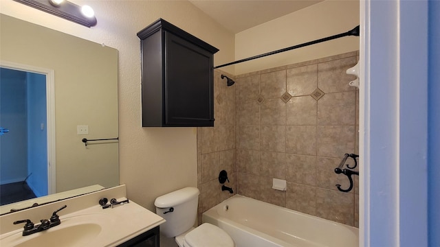 full bath featuring toilet, vanity, and shower / tub combination