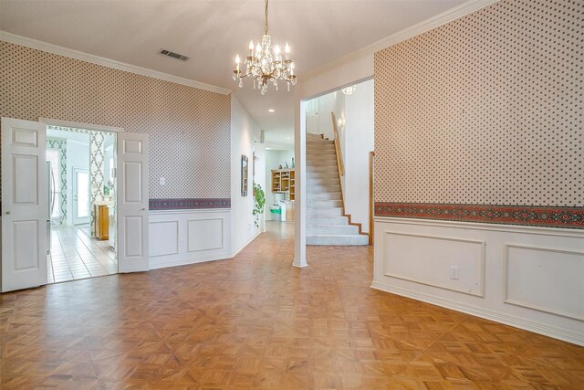 1002 Loch Lomond Dr, Arlington, TX 76012 - interior space featuring crown molding, an inviting chandelier, wallpapered walls, a wainscoted wall, and visible vents