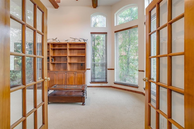 1002 Loch Lomond Dr, Arlington, TX 76012 - home office with beamed ceiling, carpet, baseboards, and french doors