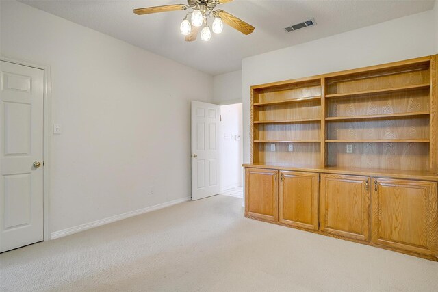 1002 Loch Lomond Dr, Arlington, TX 76012 - interior space featuring light colored carpet, visible vents, ceiling fan, and baseboards