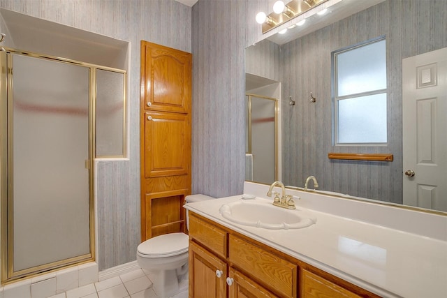 1002 Loch Lomond Dr, Arlington, TX 76012 - bathroom featuring tile patterned flooring, vanity, toilet, a shower stall, and wallpapered walls