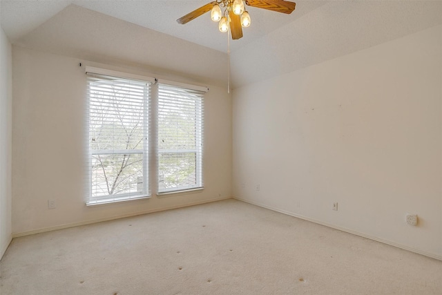 1002 Loch Lomond Dr, Arlington, TX 76012 - carpeted empty room featuring baseboards, lofted ceiling, and ceiling fan