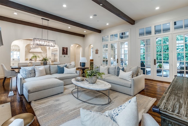3404 Marquette St, University Park, TX 75225 - living area featuring arched walkways, wood finished floors, beam ceiling, recessed lighting, and a chandelier