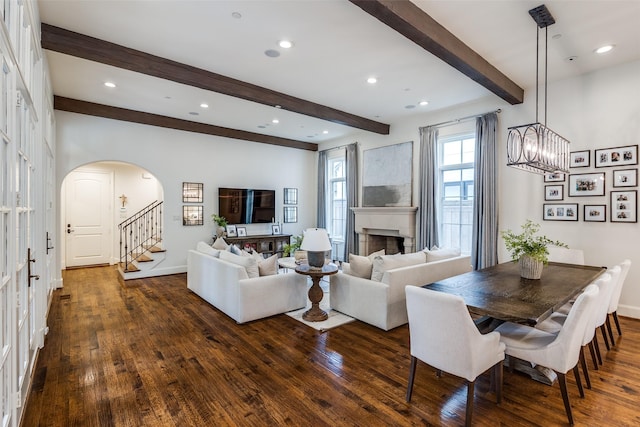 3404 Marquette St, University Park, TX 75225 - living room featuring arched walkways, beam ceiling, dark wood-type flooring, stairway, and recessed lighting