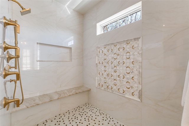 full bath featuring a marble finish shower