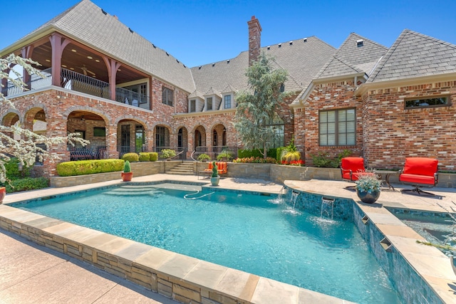 outdoor pool featuring a patio and a ceiling fan