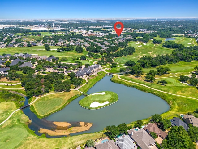 birds eye view of property with a residential view, a water view, and view of golf course