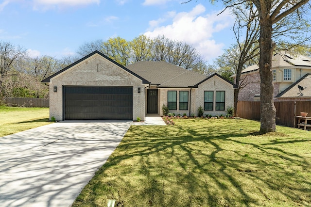 view of front of home with an attached garage, fence, brick siding, and concrete driveway