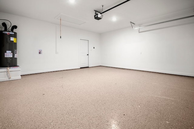garage featuring a garage door opener and electric water heater