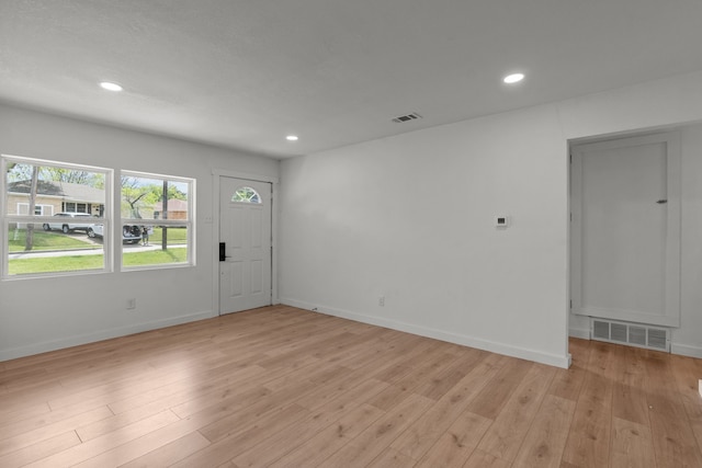 2225 Mack Ln, Dallas, TX 75227 - foyer entrance with light wood-style floors, recessed lighting, and baseboards