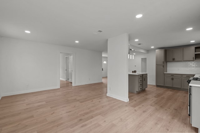 2225 Mack Ln, Dallas, TX 75227 - kitchen featuring gray cabinets, recessed lighting, backsplash, open floor plan, and open shelves