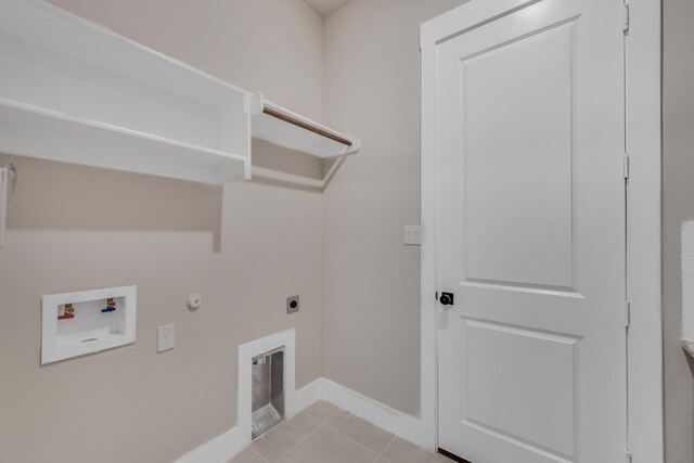 4133 Old Springtown Rd, Weatherford, TX 76085 - washroom featuring hookup for a washing machine, light tile patterned flooring, electric dryer hookup, laundry area, and hookup for a gas dryer
