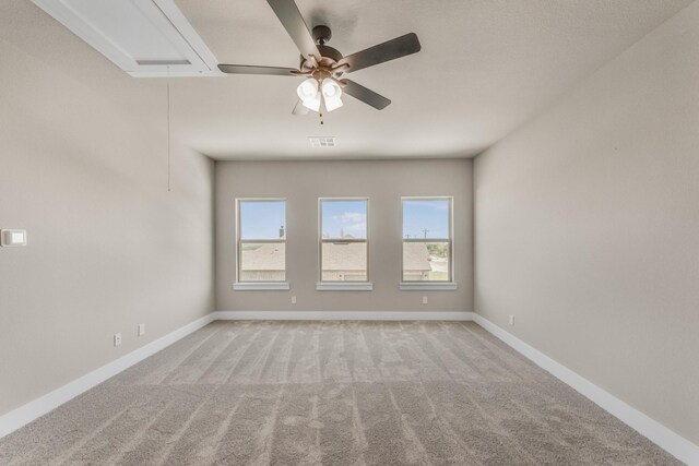 4133 Old Springtown Rd, Weatherford, TX 76085 - spare room featuring attic access, baseboards, visible vents, and light carpet