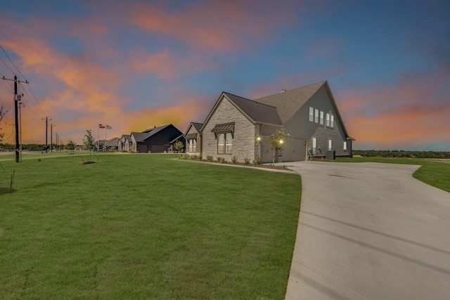 4133 Old Springtown Rd, Weatherford, TX 76085 - property exterior at dusk with stone siding, driveway, a yard, and an attached garage