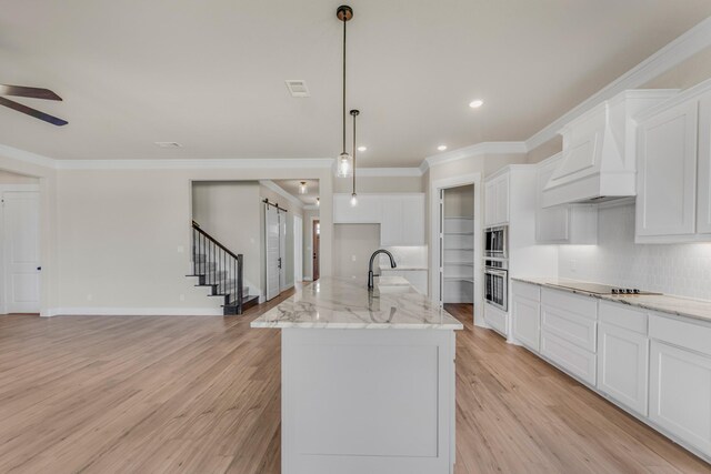 4133 Old Springtown Rd, Weatherford, TX 76085 - kitchen with white cabinetry, light wood-style flooring, stainless steel appliances, ceiling fan, and ornamental molding