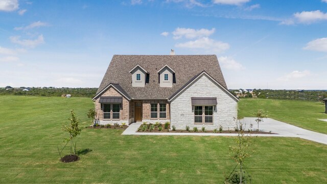 4133 Old Springtown Rd, Weatherford, TX 76085 - view of front of house featuring stone siding, a chimney, roof with shingles, and a front lawn