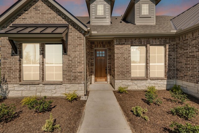 4133 Old Springtown Rd, Weatherford, TX 76085 - doorway to property featuring a shingled roof and brick siding