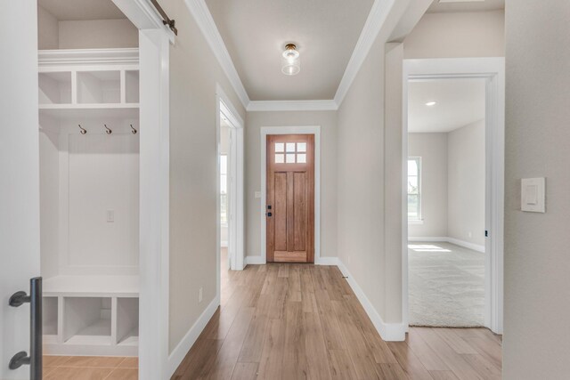 4133 Old Springtown Rd, Weatherford, TX 76085 - foyer entrance with ornamental molding, baseboards, and light wood-style floors