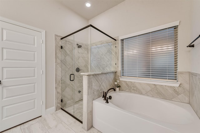full bathroom featuring a bath, marble finish floor, and a shower stall