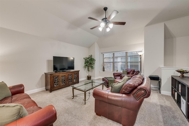 carpeted living room with a ceiling fan, baseboards, and vaulted ceiling