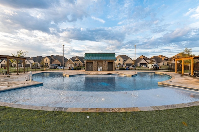 pool featuring a residential view and a patio