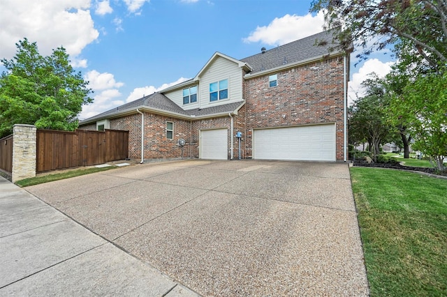 view of front of home with roof with shingles, concrete driveway, fence, an attached garage, and brick siding
