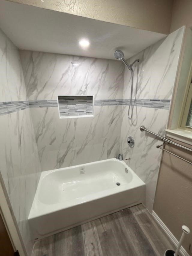 623 Middale Rd, Duncanville, TX 75116 - bathroom with wood finished floors and washtub / shower combination