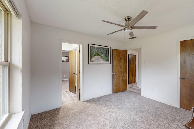 623 Middale Rd, Duncanville, TX 75116 - unfurnished bedroom featuring carpet flooring, a ceiling fan, and baseboards