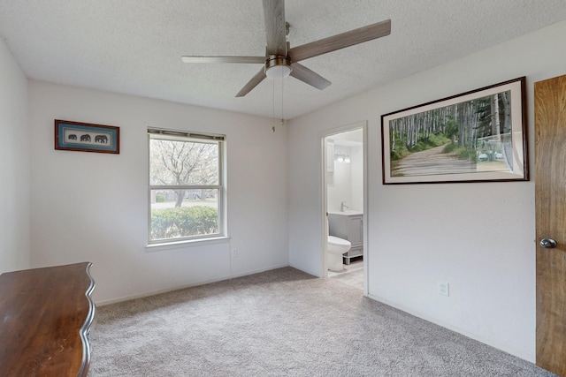 623 Middale Rd, Duncanville, TX 75116 - unfurnished bedroom with carpet, a textured ceiling, connected bathroom, ceiling fan, and baseboards