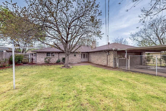 623 Middale Rd, Duncanville, TX 75116 - rear view of property with a gate, a chimney, brick siding, and an attached carport