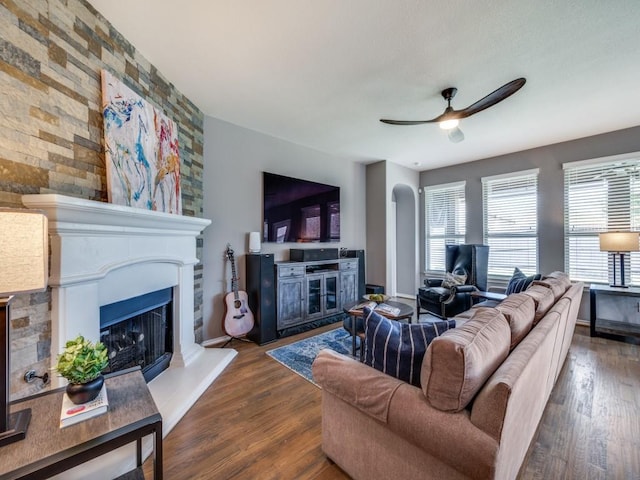 3009 Morning Star Dr, Little Elm, TX 75068 - living room with baseboards, wood finished floors, a fireplace with raised hearth, and ceiling fan