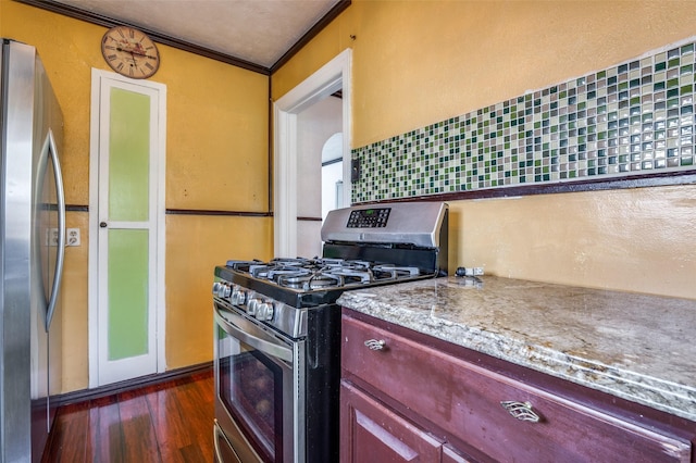 635 Richmondell, Dallas, TX 75211 - kitchen with appliances with stainless steel finishes, dark wood-style floors, crown molding, dark brown cabinets, and light stone countertops