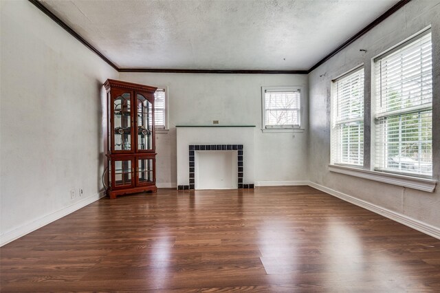 635 Richmondell, Dallas, TX 75211 - unfurnished living room with a tile fireplace, ornamental molding, wood finished floors, a textured ceiling, and baseboards
