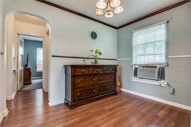 635 Richmondell, Dallas, TX 75211 - empty room featuring arched walkways, a chandelier, dark wood finished floors, cooling unit, and ornamental molding