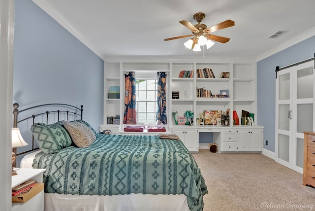 bedroom featuring visible vents, a barn door, ornamental molding, ceiling fan, and light carpet