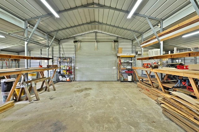 821 Seeton Rd, Mansfield, TX 76063 - garage with a workshop area and metal wall