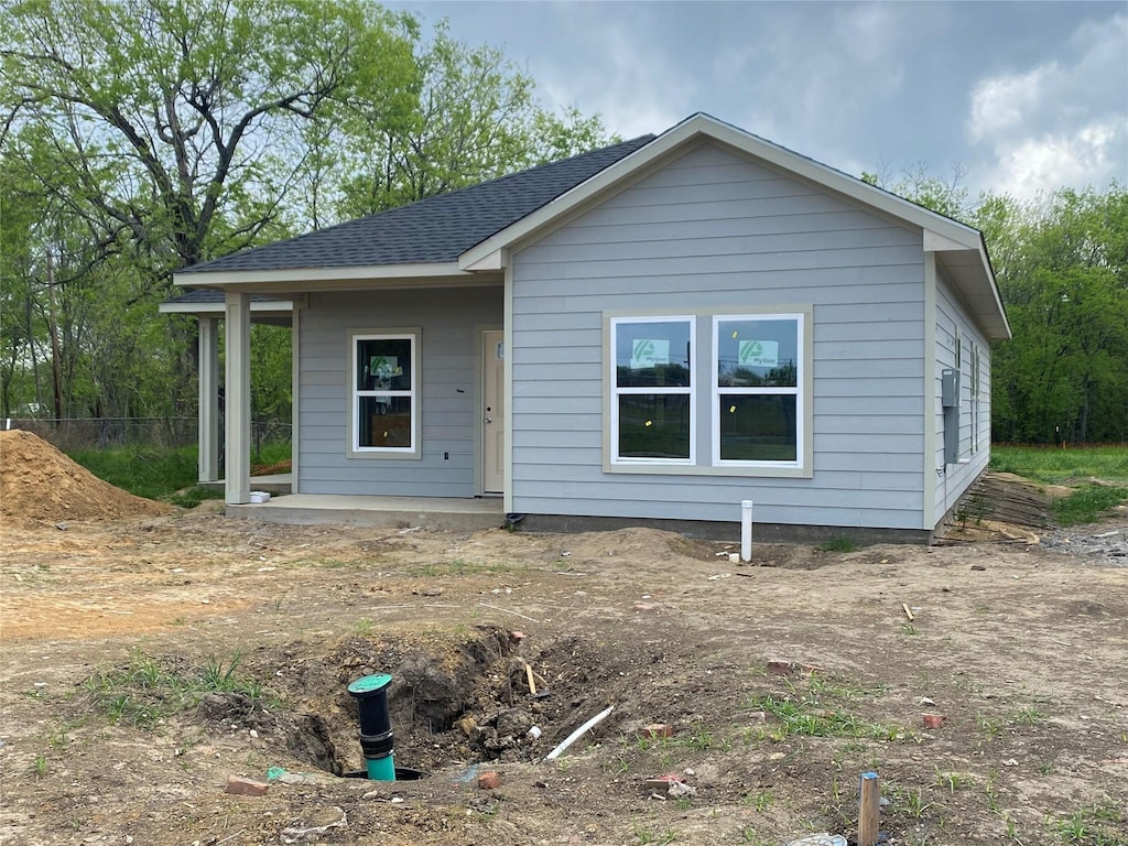 view of front of house with a shingled roof