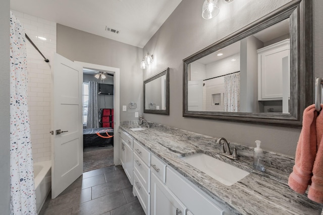 804 Shirley Jean Ln, Collinsville, TX 76233 - bathroom with double vanity, shower / bath combo with shower curtain, a ceiling fan, tile patterned flooring, and ensuite bathroom