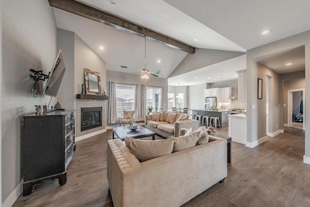 804 Shirley Jean Ln, Collinsville, TX 76233 - living area with beam ceiling, baseboards, a glass covered fireplace, dark wood-type flooring, and a ceiling fan